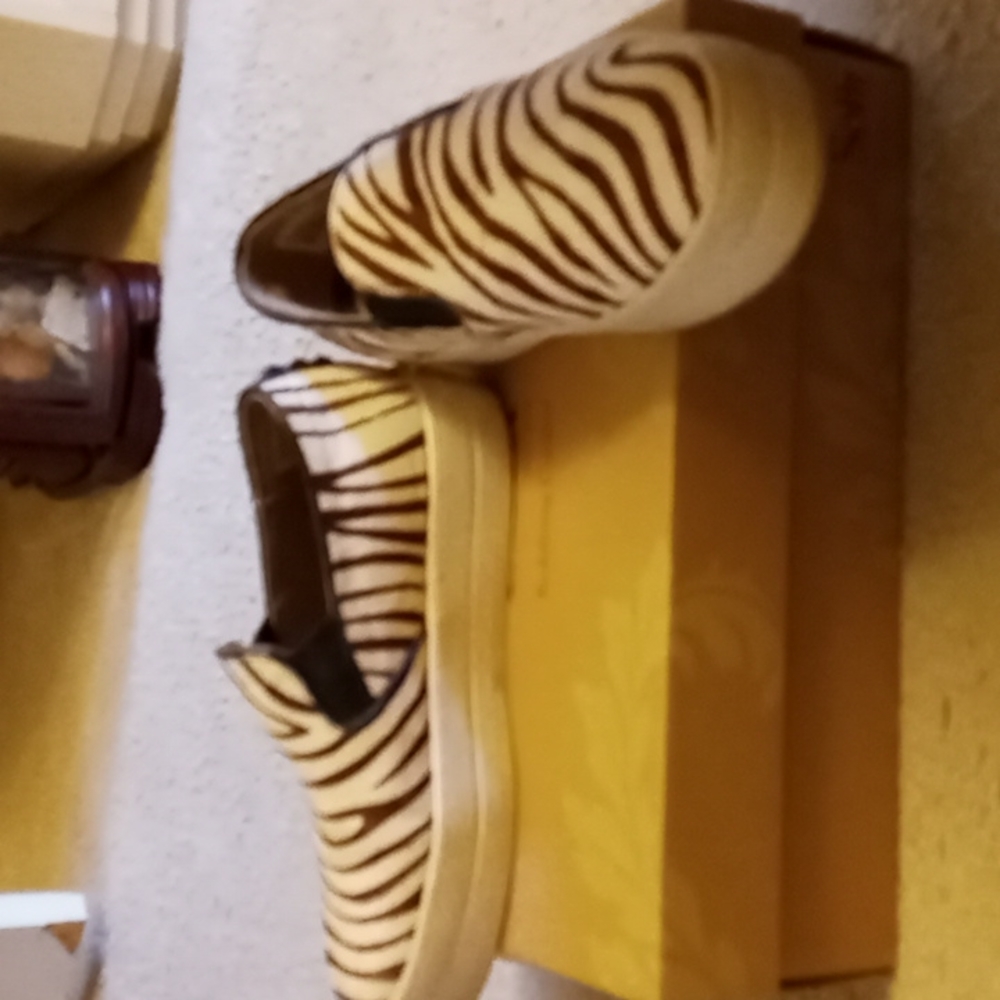 Sketchers pony haired slip ons